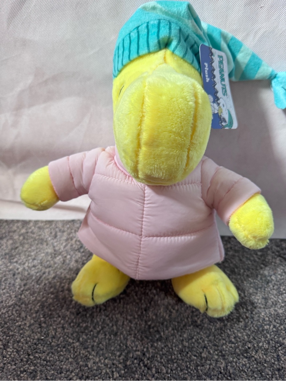Peanuts Yellow Woodstock Plush with Pink Puffer Jacket and Teal Striped Hat